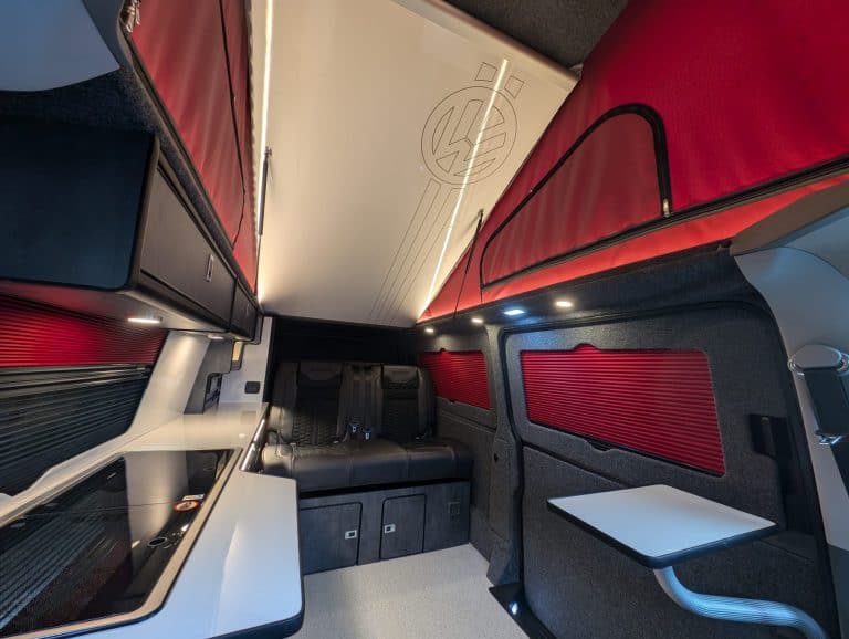 Modern high-speed train interior with comfortable seating and sleek design.