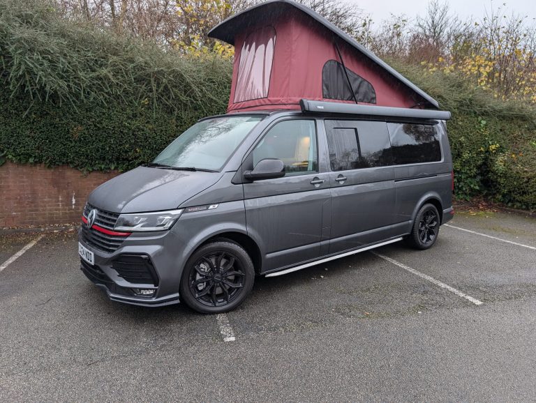 Custom camper van with a raised pop-up roof for extra sleeping space and comfort. Perfect for outdoo.