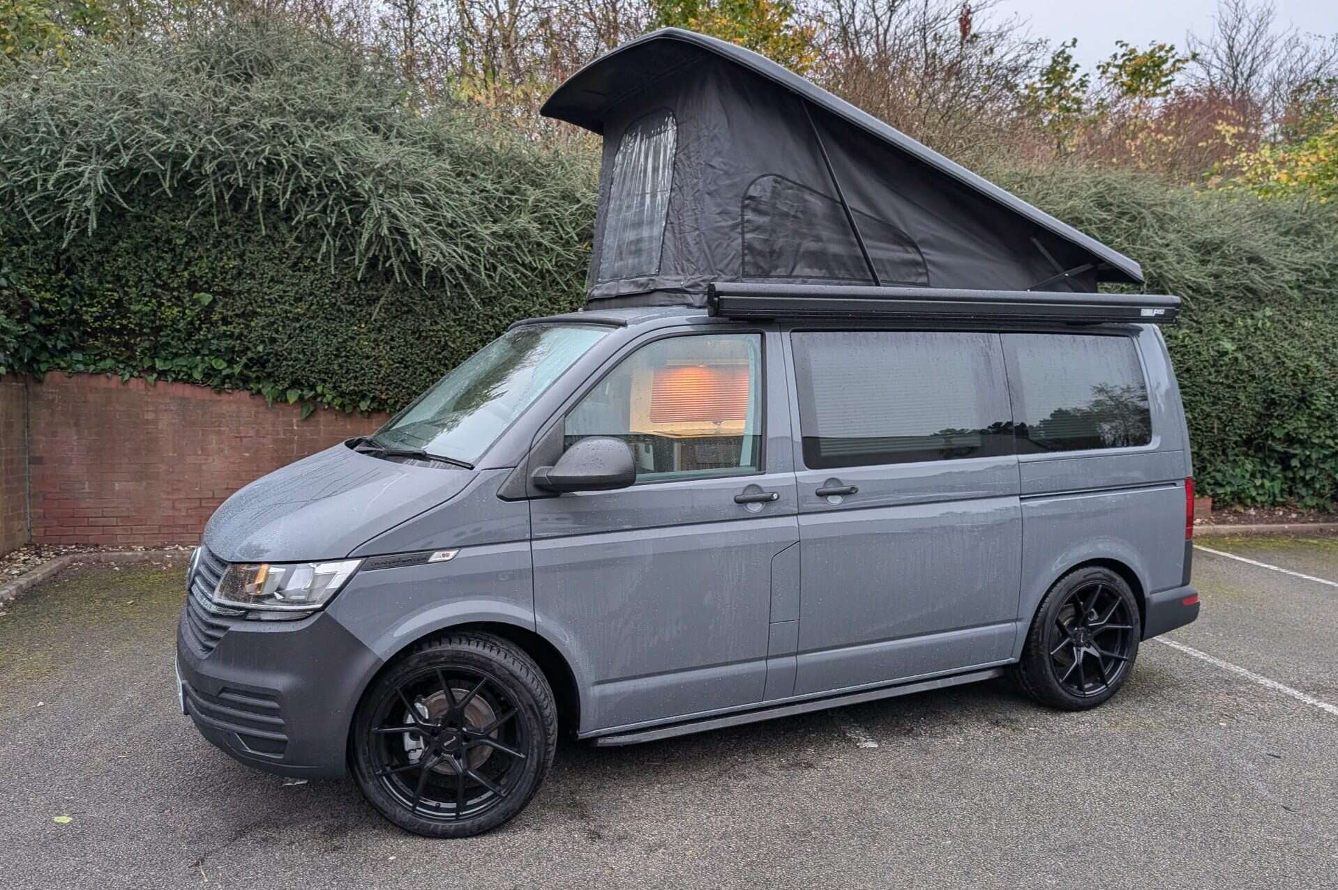 High-quality camper van with pop-up roof for outdoor adventures.
