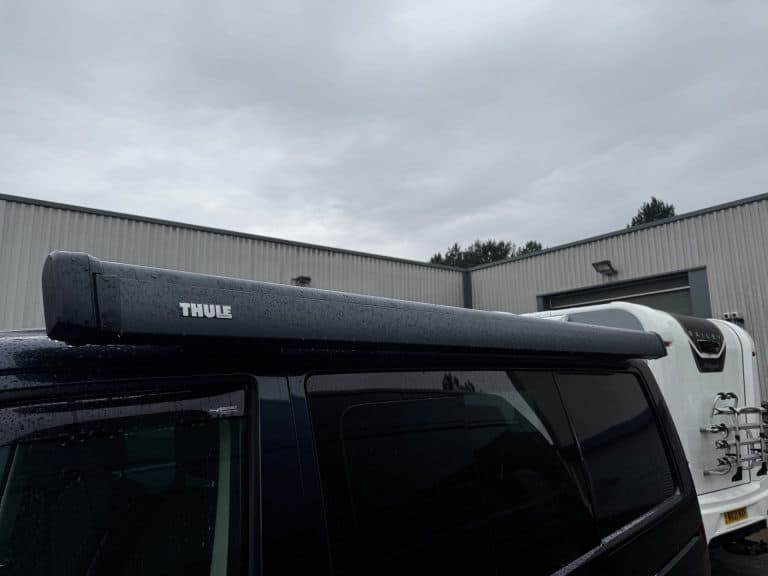 Roof rack fitted on camper van for extra storage and utility.